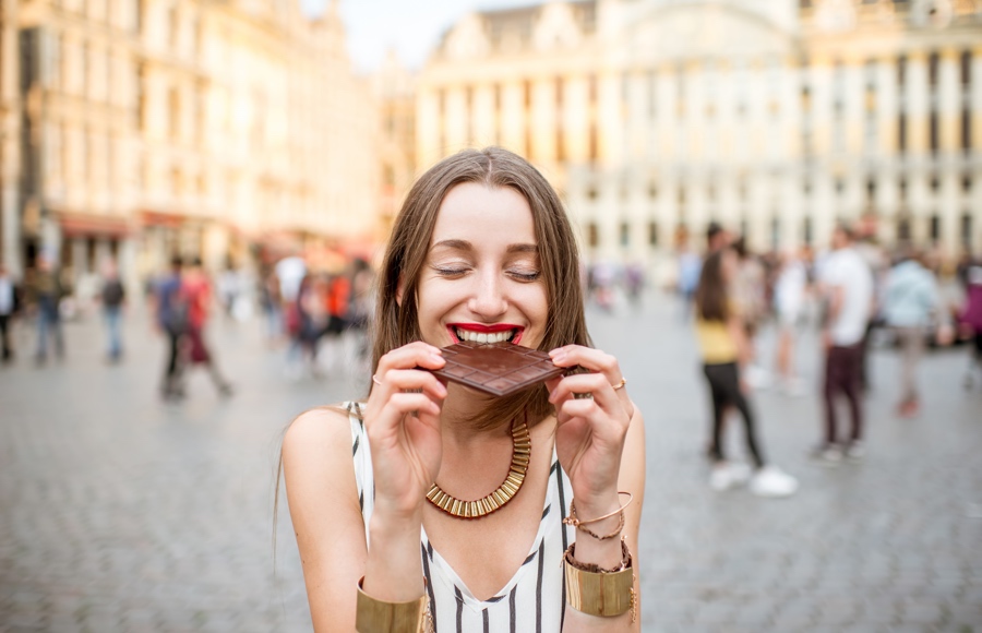 Girl tasting chocolate in Barcelona